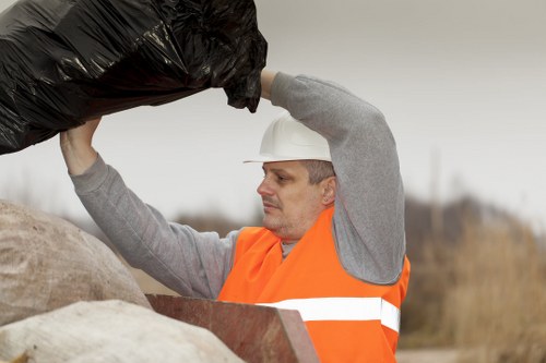 Professional waste clearance team managing construction debris.
